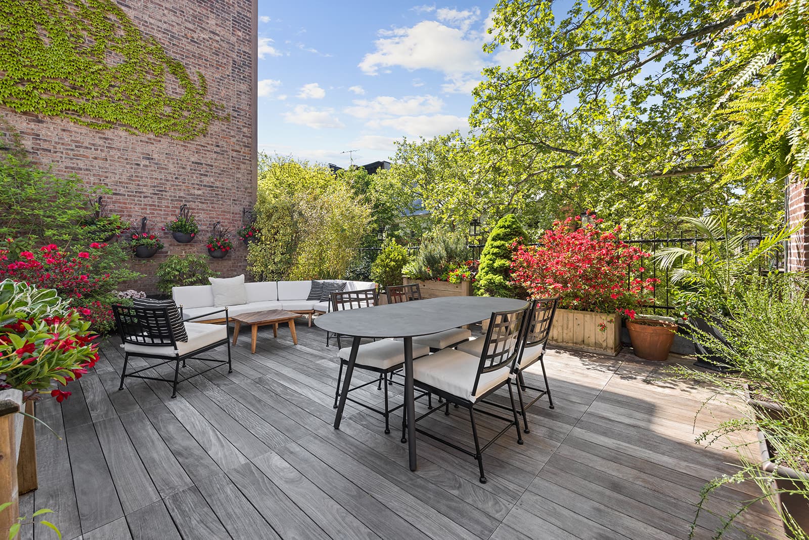 An outdoor dining table on the roof terrace